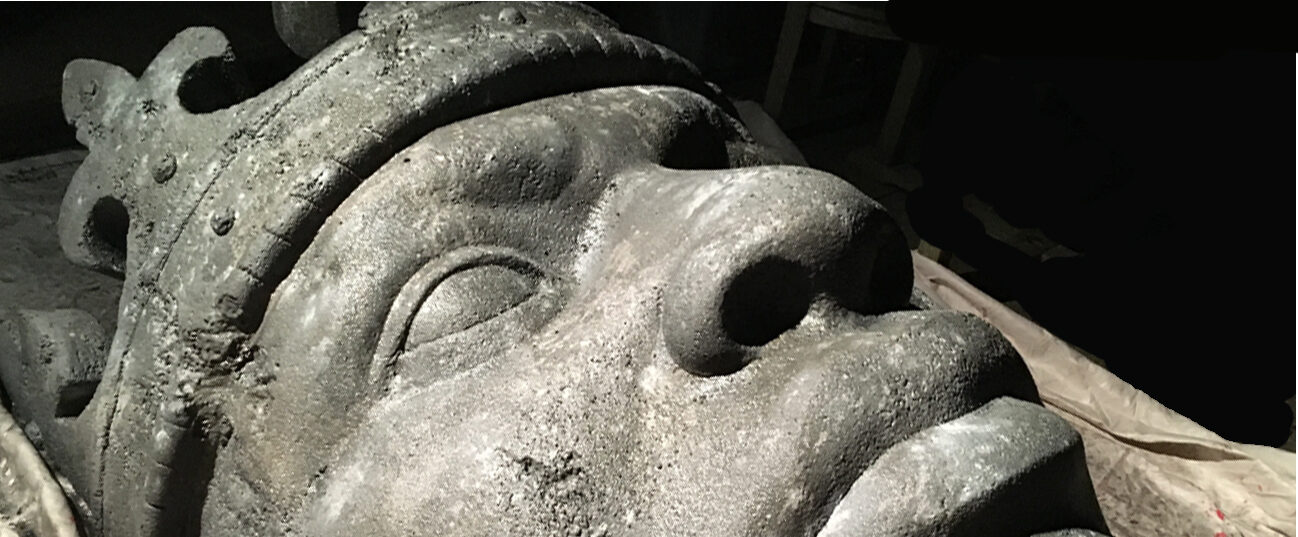 A large sculpted stone head made in the Armordillo studio